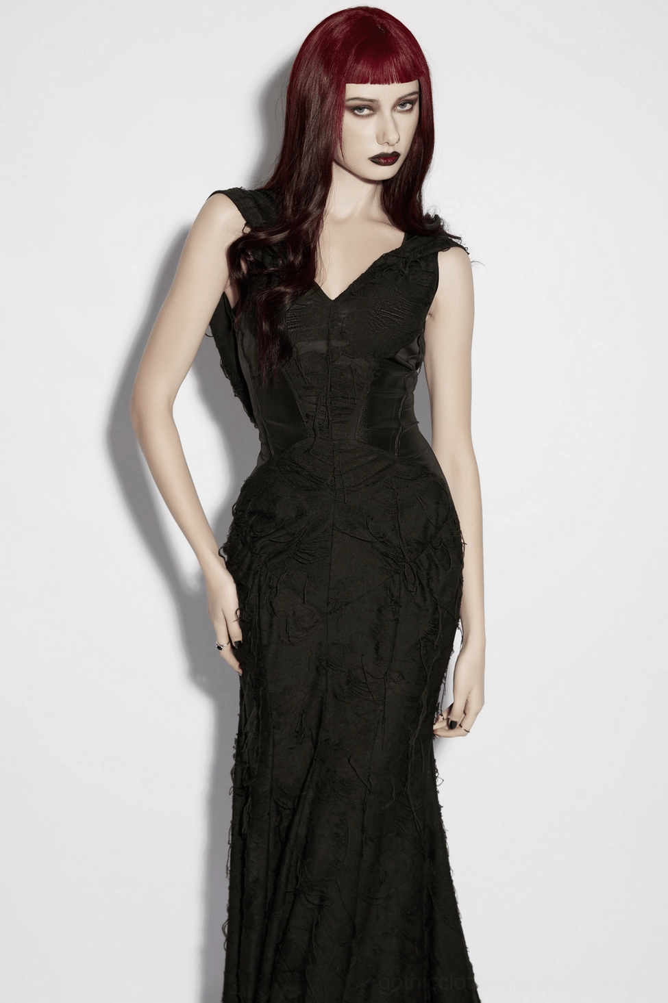 Hooded gothic dress fabric detail showing faux leather panel inserts and distressed weave texture