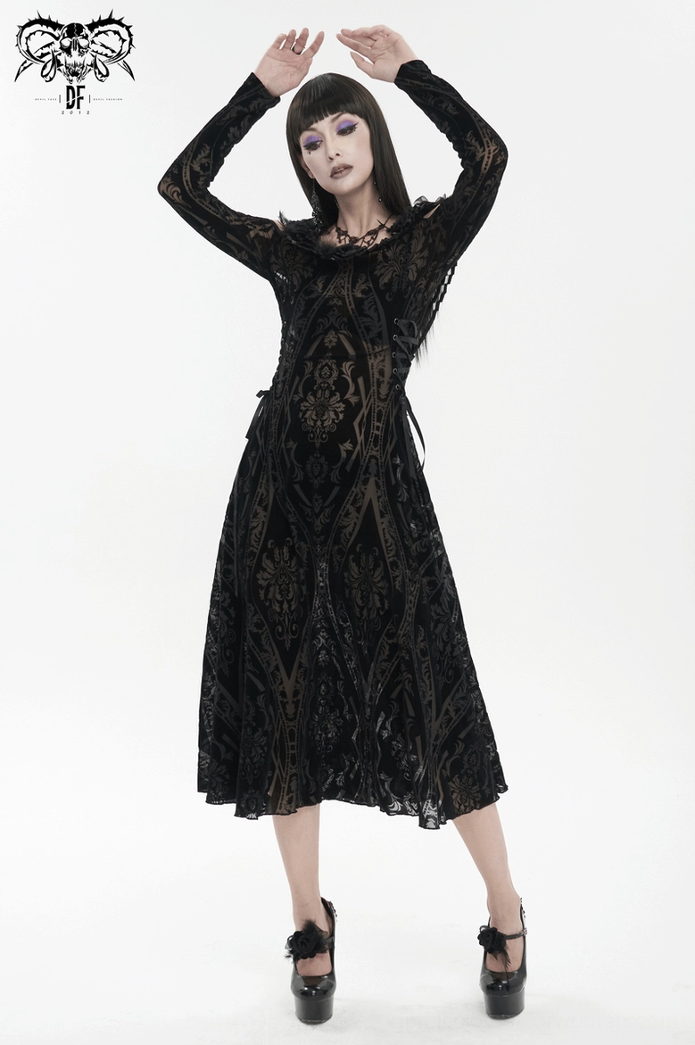 Detail shot of gothic off-shoulder dress featuring feather-trimmed shoulders and semi-sheer damask patterned fabric