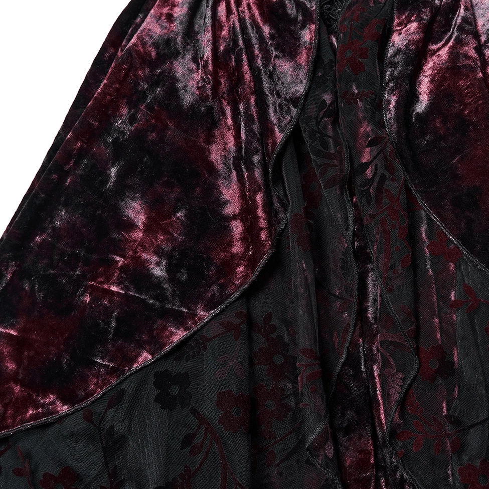 Close-up detail of gothic velvet dress fabric and dark tulle hem showing floral velvet pattern