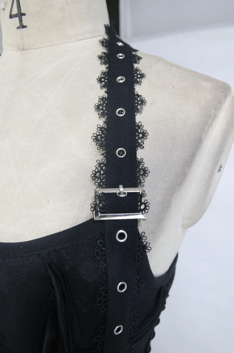 Close-up of black gothic dress halter strap with lace trim, metal eyelets and adjustable buckle