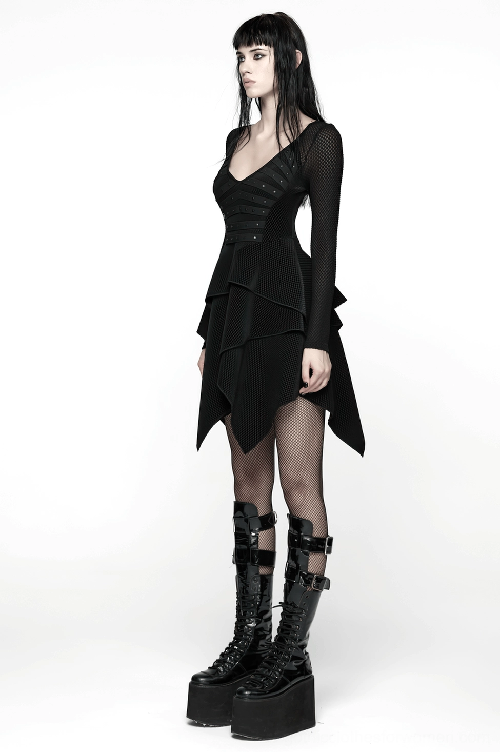 Gothic black mesh dress layered hem close-up detail showing asymmetric ruffled tiers and movement