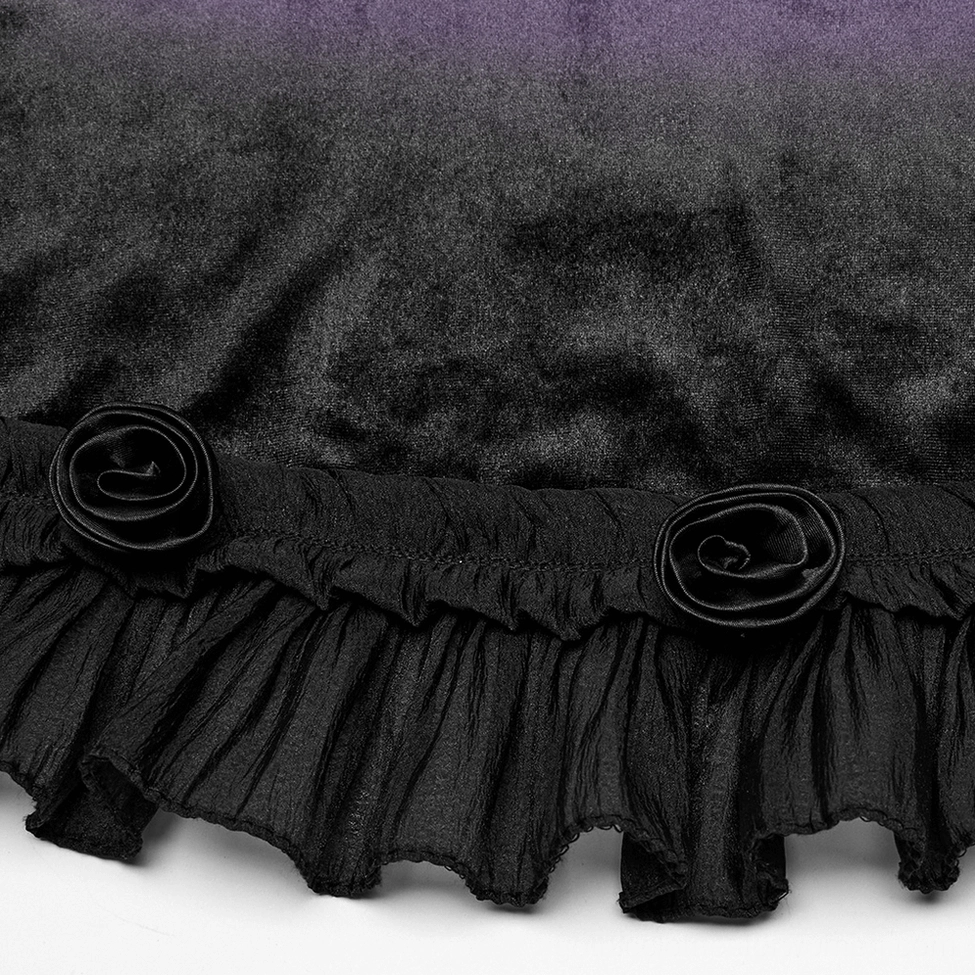 Close-up of black ruffled hem with fabric rose ornaments on purple velvet gothic dress
