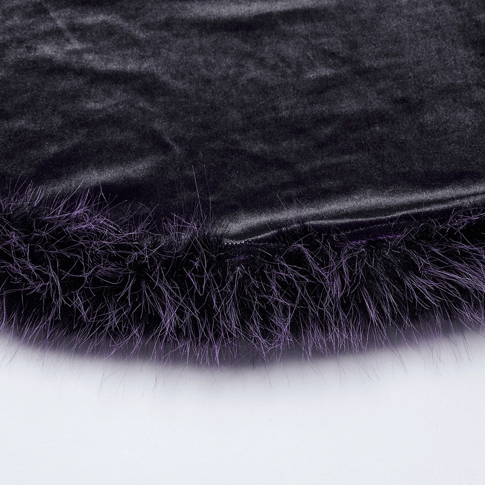 Detail shot of purple gothic dress hem and gradient faux fur trim, showcasing shiny velvet texture and layered fur effect
