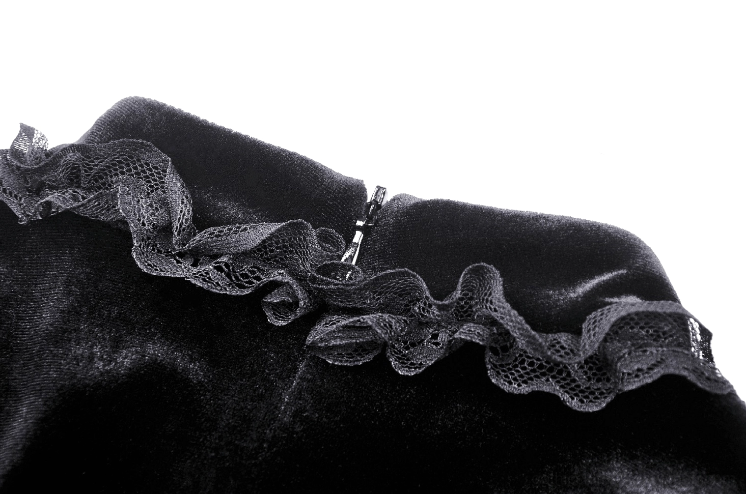 Victorian gothic dress hem detail featuring delicate lace trim with embellished beadwork