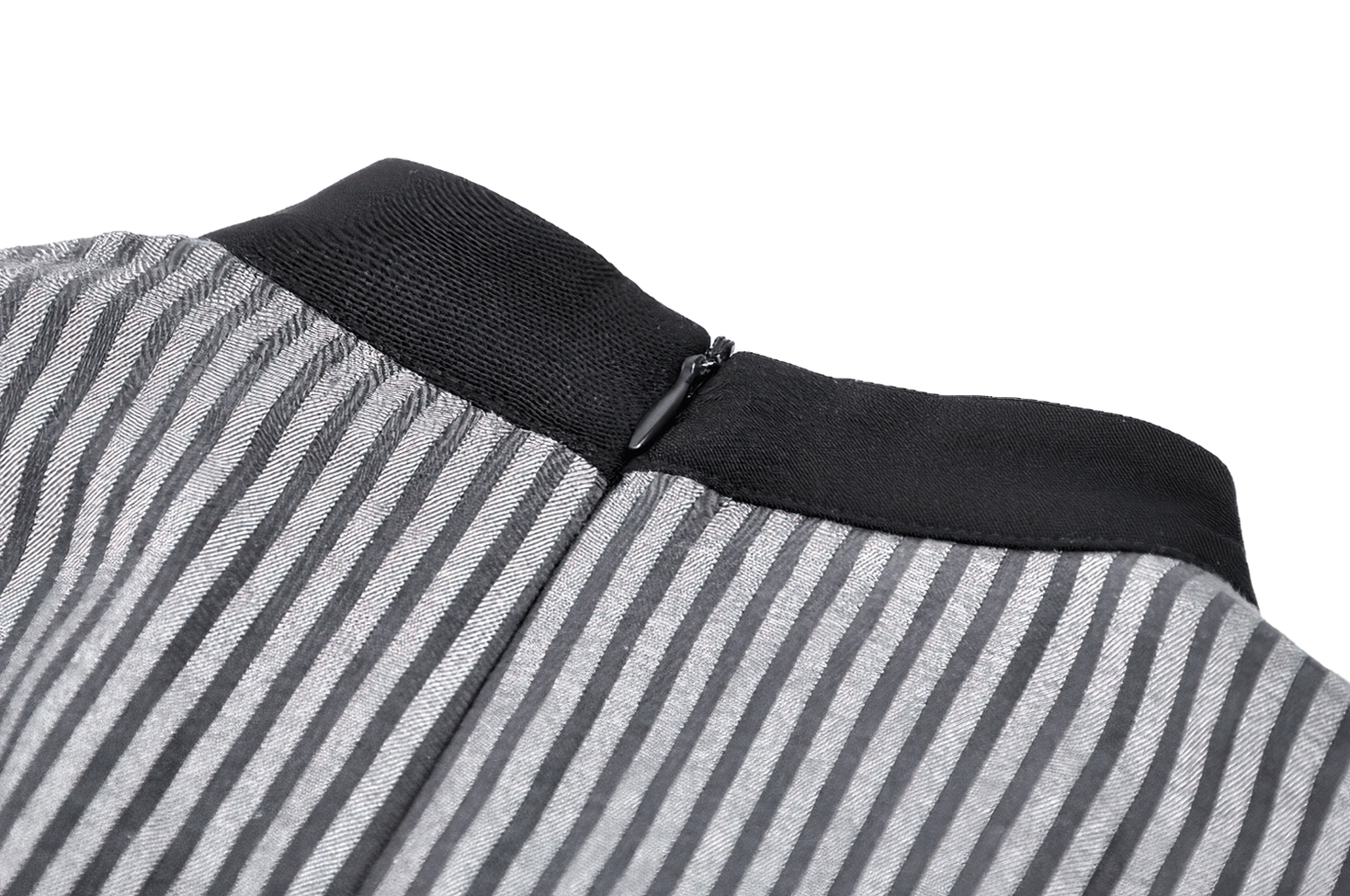 Close-up of hidden zipper closure and black waistband on gray-black striped gothic dress back waist