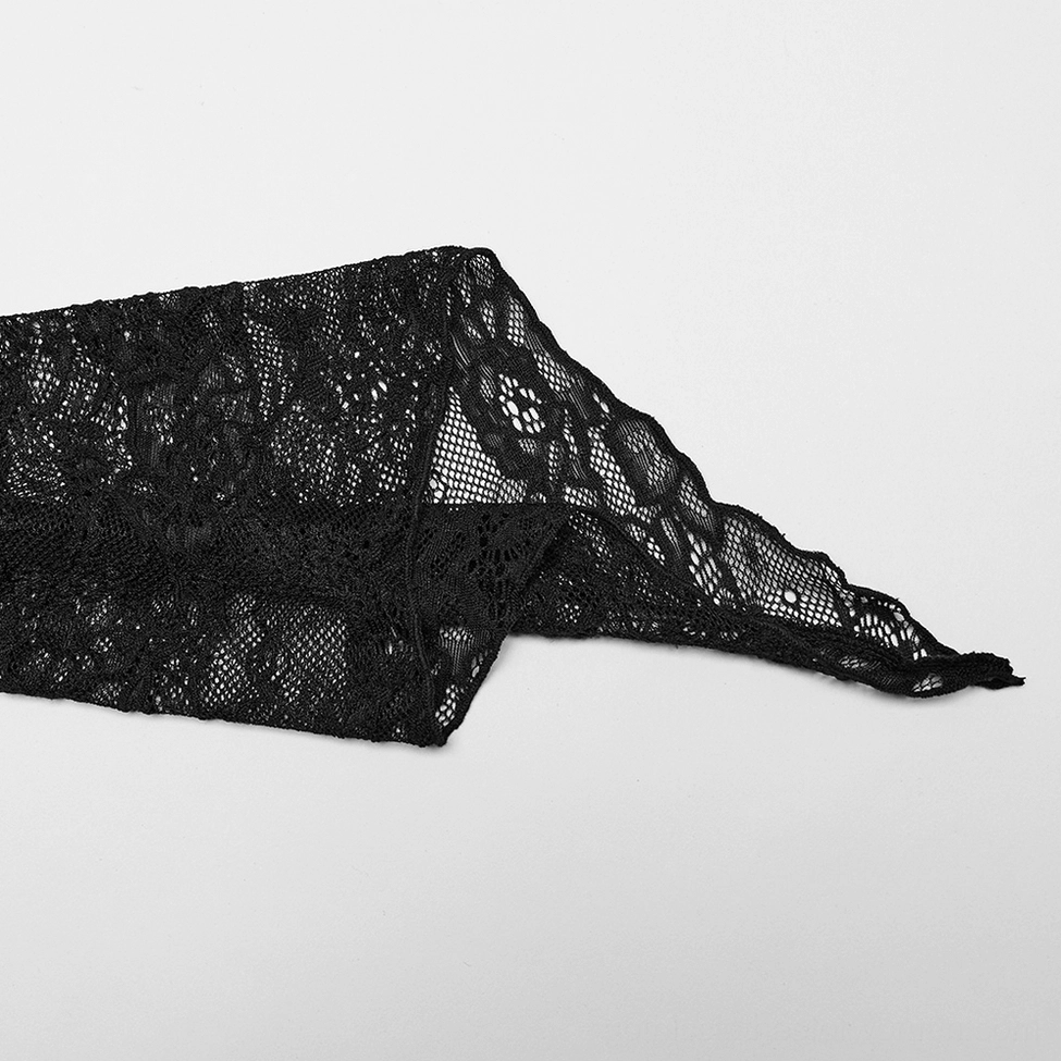 Close-up texture of floral lace sleeve cuff with flared design and solid black knit body