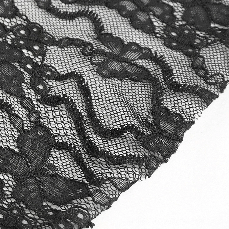 Macro detail of black lace bell sleeve fabric, floral embroidered sheer lace with scalloped edges