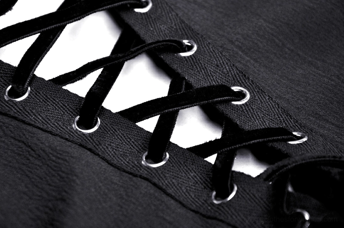 Close-up of black gothic dress lace-up back showing velvet lace straps and metal eyelet fasteners