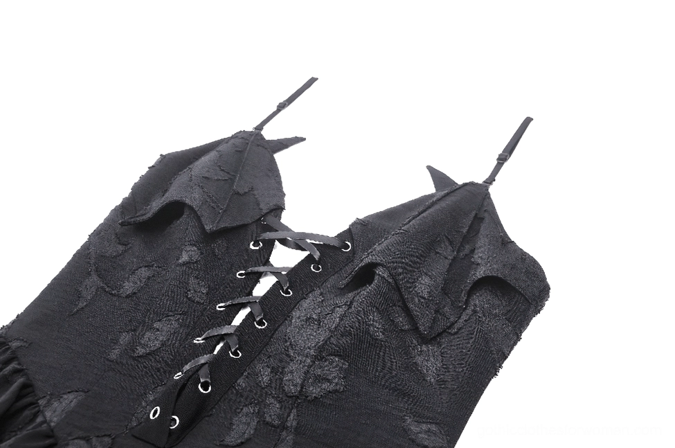 Close-up detail of black gothic dress lace-up bodice showing metal eyelets and floral jacquard fabric texture