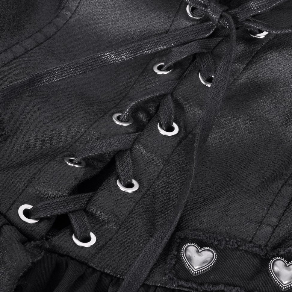 Close-up detail of lace-up grommet construction on gothic dress corset bodice with black coated fabric
