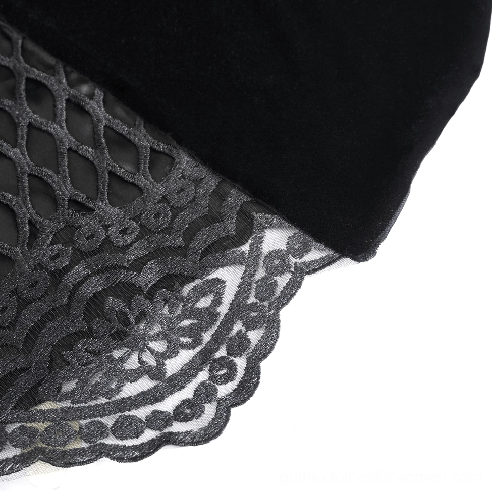 Close-up of black gothic dress fabric showing embroidered lace mesh combined with solid velvet in rich black tone