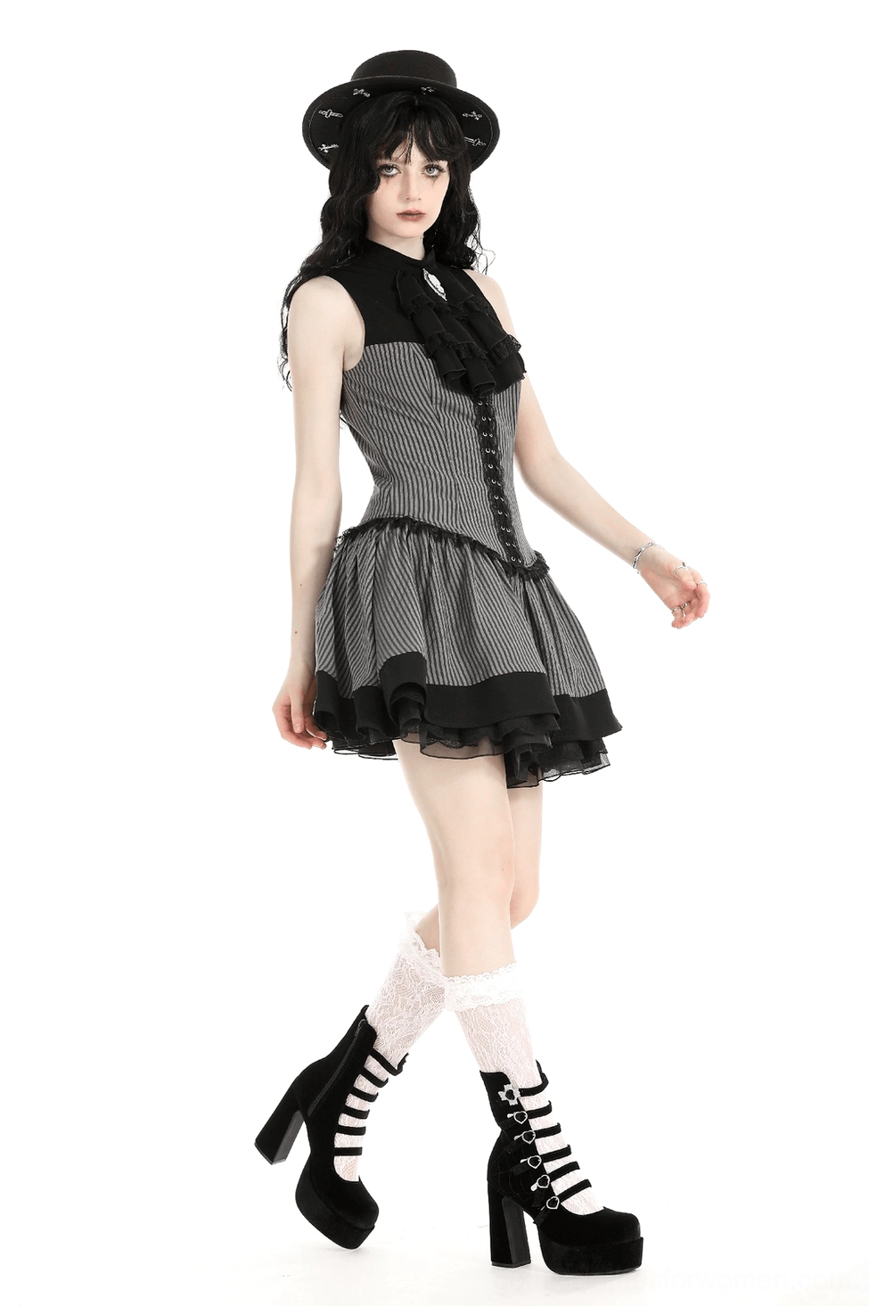 Detail view of layered ruffled hem construction and black tulle overlay on gothic striped dress