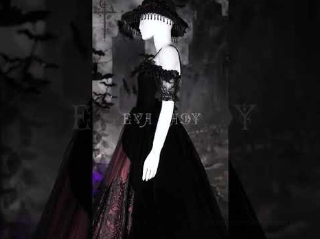 Gothic Victorian off-shoulder velvet dress on mannequin with gothic accessories and dark backdrop side view