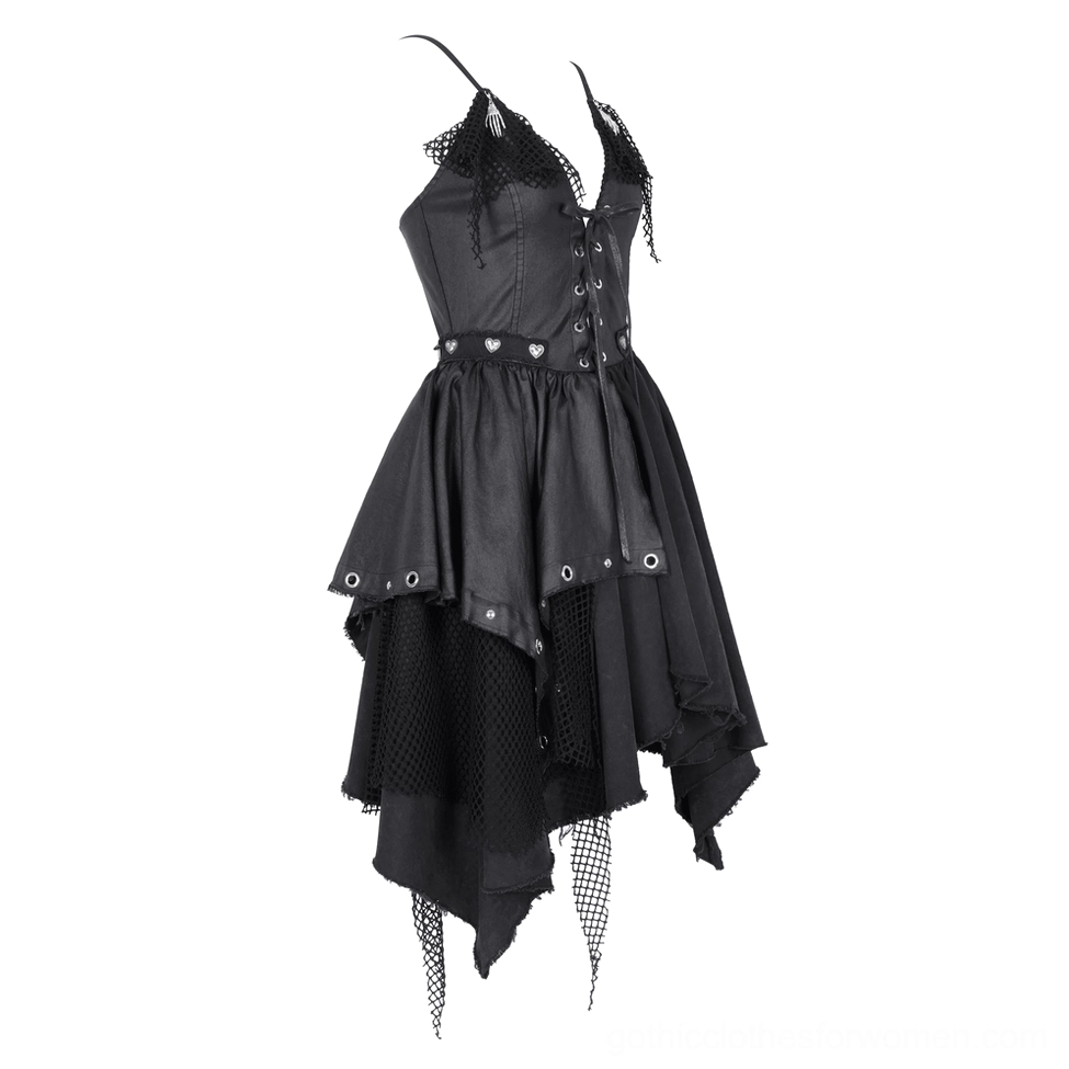 Front three-quarter view of gothic asymmetric dress highlighting heart-shaped metal buttons and fishnet trim details