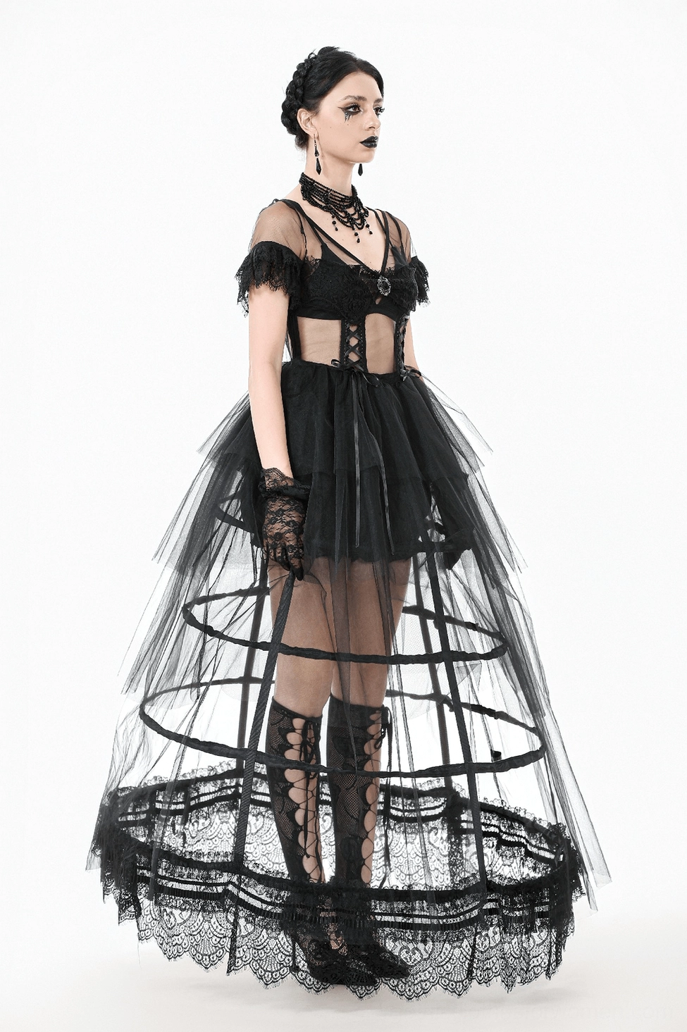 Black gothic tulle maxi dress movement shot showing dramatic silhouette and flowing tiered layers