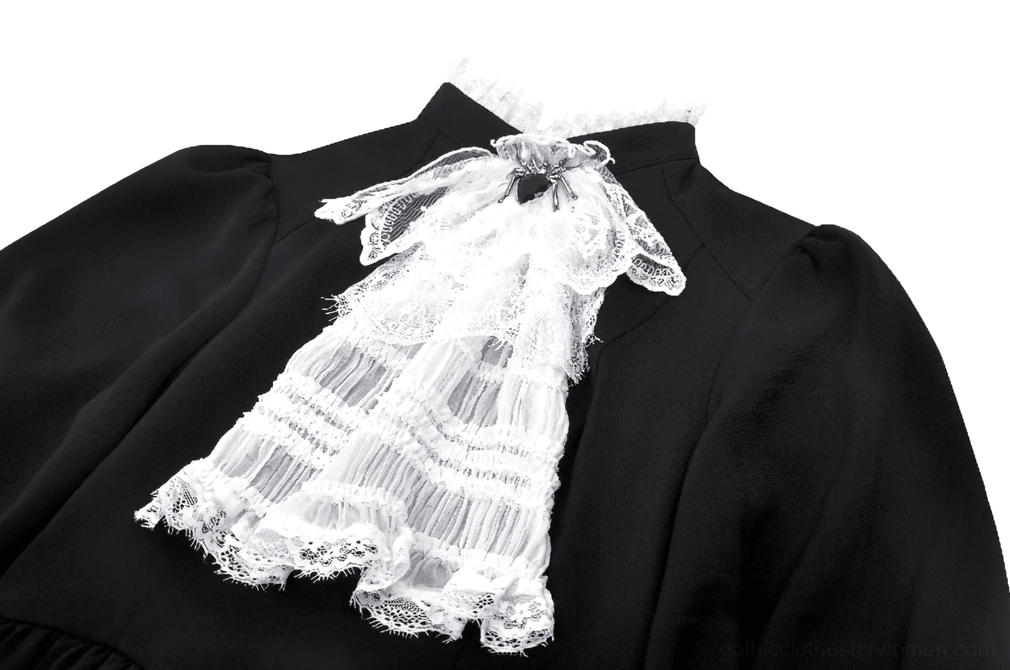 Close-up detail of gothic dress ruffled white lace jabot and heart-shaped brooch at neckline