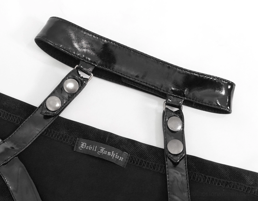 Detail view of gothic dress neck strap and patent leather material with metal rivet fasteners and branding