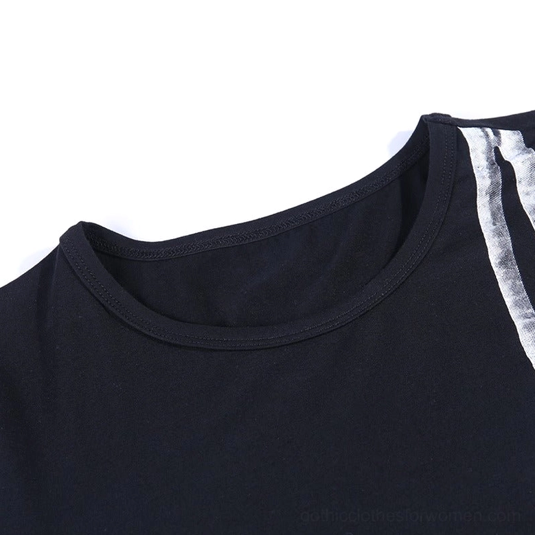 Close-up detail of crew neckline on black bodycon dress showing knit fabric texture and edge of skeleton print
