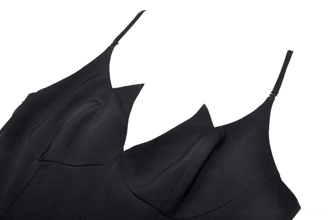 Close-up detail of black gothic dress sweetheart spaghetti strap neckline and plunging V-neckline design