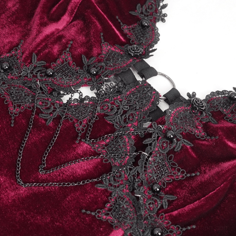 Close-up view of black floral lace neckline with metal chain accents and bead embellishments