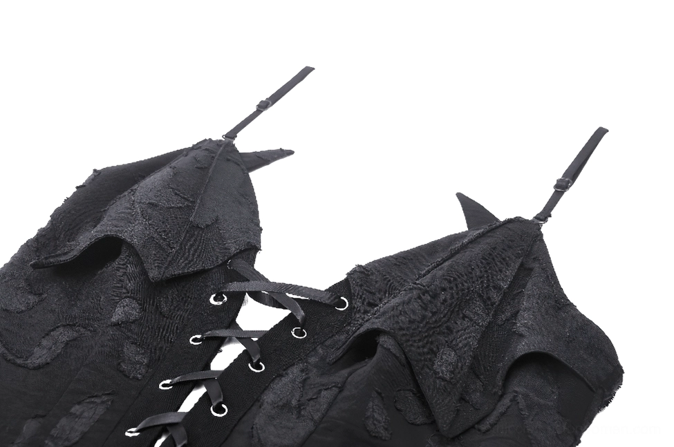 Close-up detail of gothic dress neckline with spiky strap details and reinforced metal eyelets