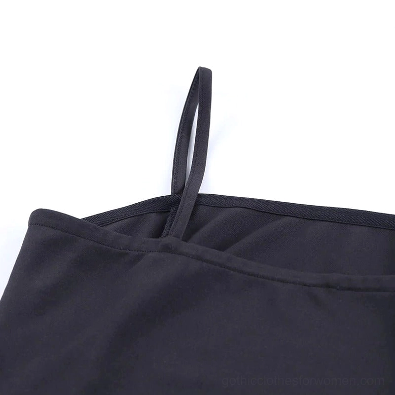 Close-up of black gothic dress neckline and thin spaghetti strap detail