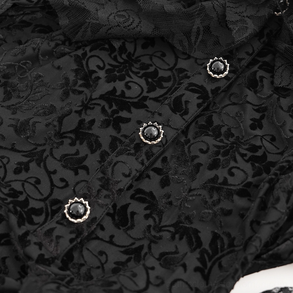 Metal-framed gemstone decorative buttons and ornate floral velvet fabric detail on black gothic dress