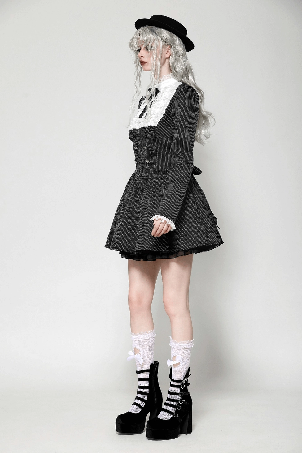 Black gothic dress pinstripe pattern close-up showcasing fabric weave and monochromatic stripe design