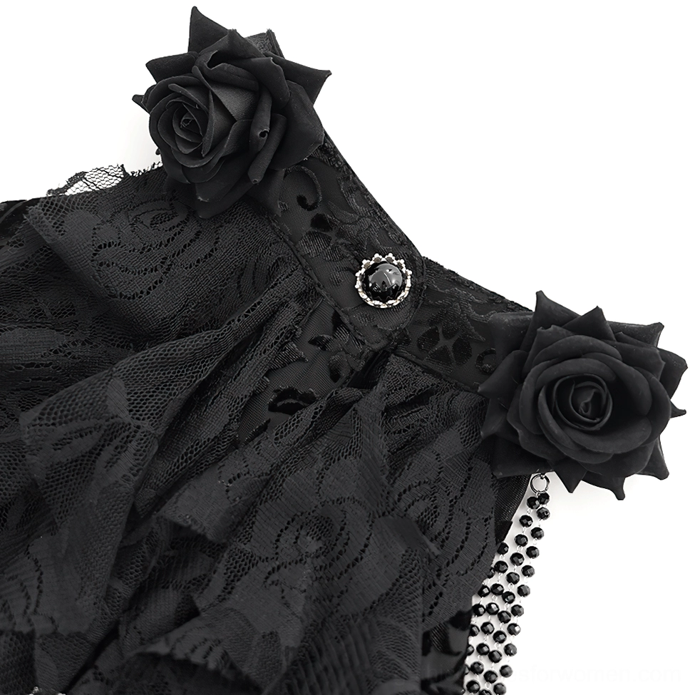 Close-up of rose flower appliqués and gemstone button embellishments on gothic dress neckline