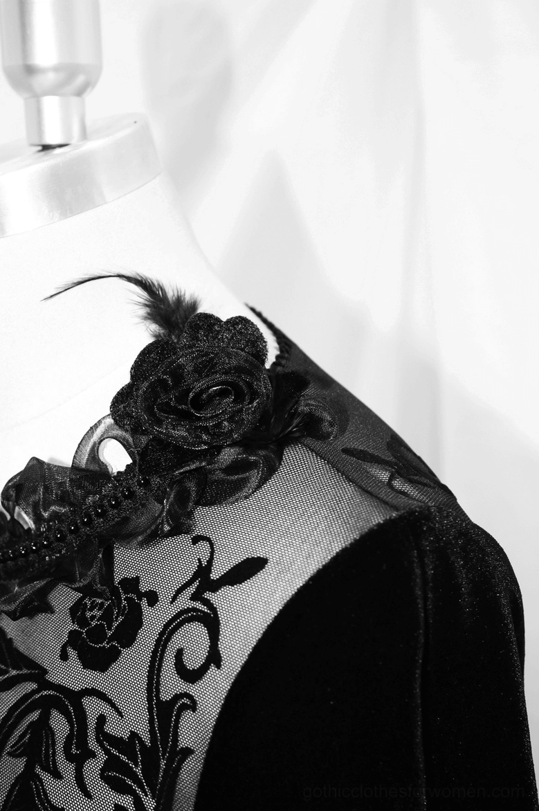 Close-up shoulder decoration detail with velvet rose applique and filigree lace on mesh panel