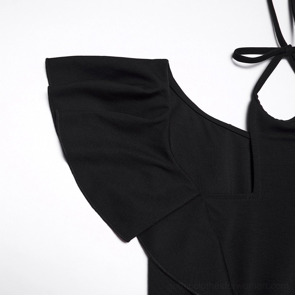 Detail shot of soft ruffle sleeve and integrated halter tie on black gothic dress neckline