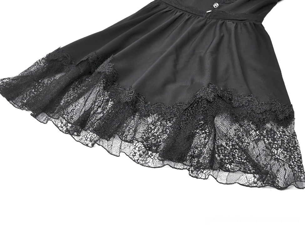 Side close-up view of black gothic dress hemline showing layered ruffled lace and sheer fabric texture