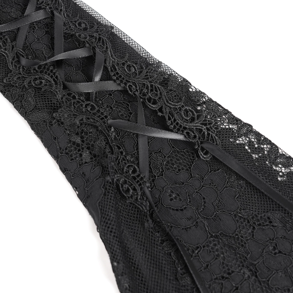 Close-up detail of black satin ribbon lacing and floral lace trim on gothic mini dress