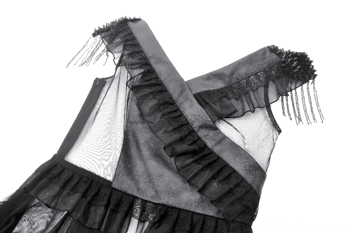 Close-up detail of gothic dress shoulder strap featuring ruffled trim, tassel fringe accents, and mesh panel overlay on tulle