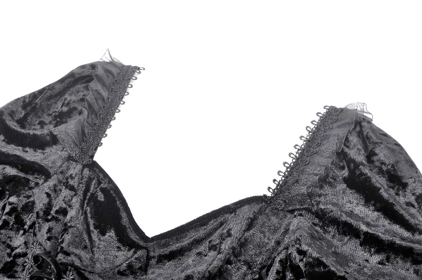Detailed view of black gothic dress shoulder smocking and lace trim embellishment on crushed velvet fabric
