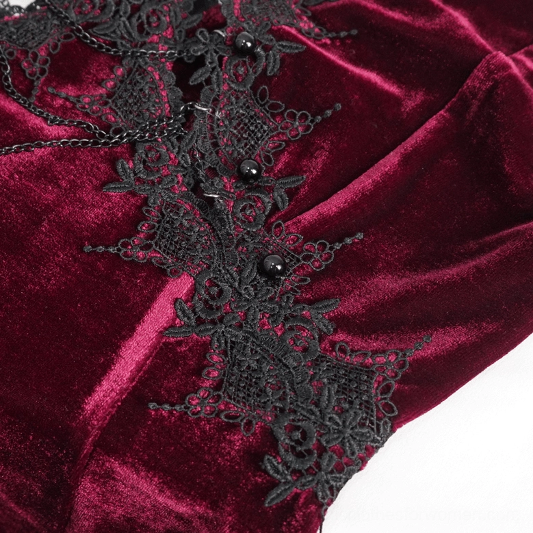 Side detail of black lace appliqué with bead embellishments showing velvet fabric texture and construction