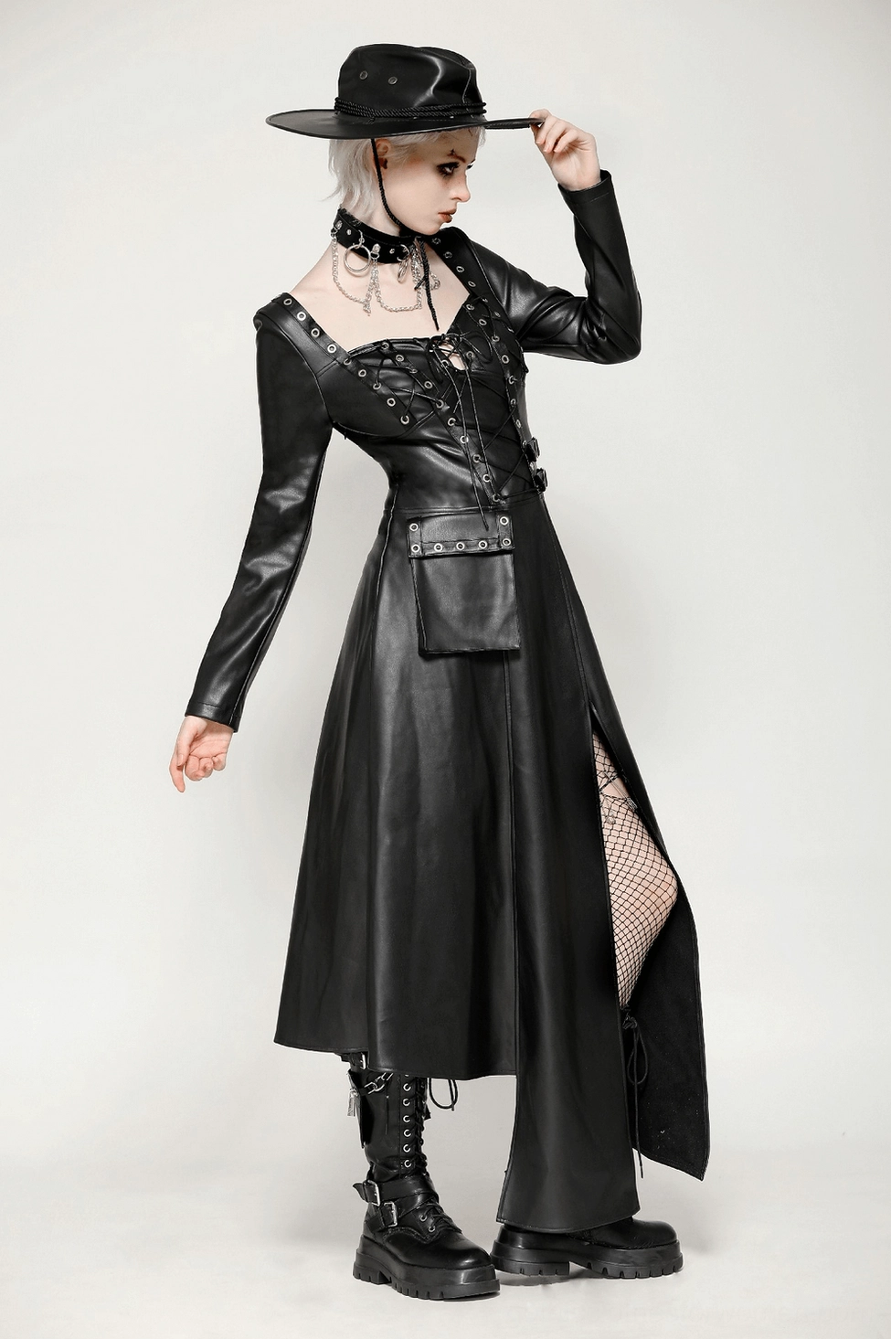 Black faux leather gothic dress side profile showing asymmetrical hemline and drape