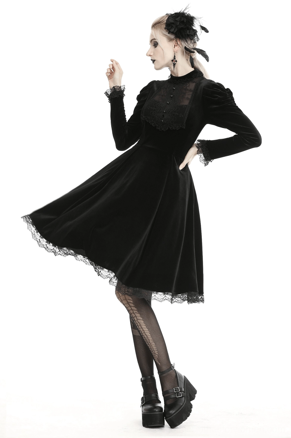 Side profile view of gothic velvet dress highlighting fitted waist and flowing midi skirt