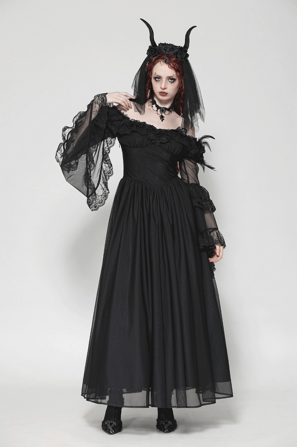 Gothic black dress side profile showing layered lace sleeves, corset waist, and romantic silhouette of maxi length