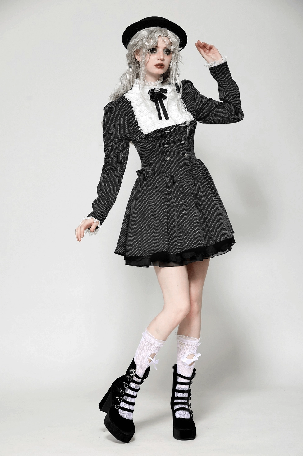 Black gothic pinstripe dress side angle showing fitted waist, flared pleated skirt, and sleeve volume