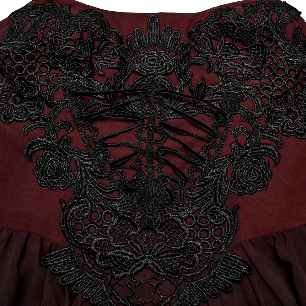 Close-up of intricate black skeleton floral lace bodice with central corset lace-up feature