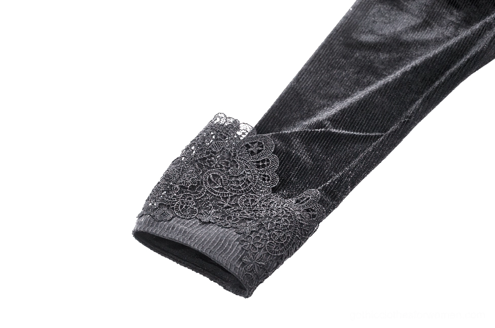 Close-up detail of black velvet gothic dress puff sleeve cuff showing lace trim, smooth velvet material, and sleeve construction