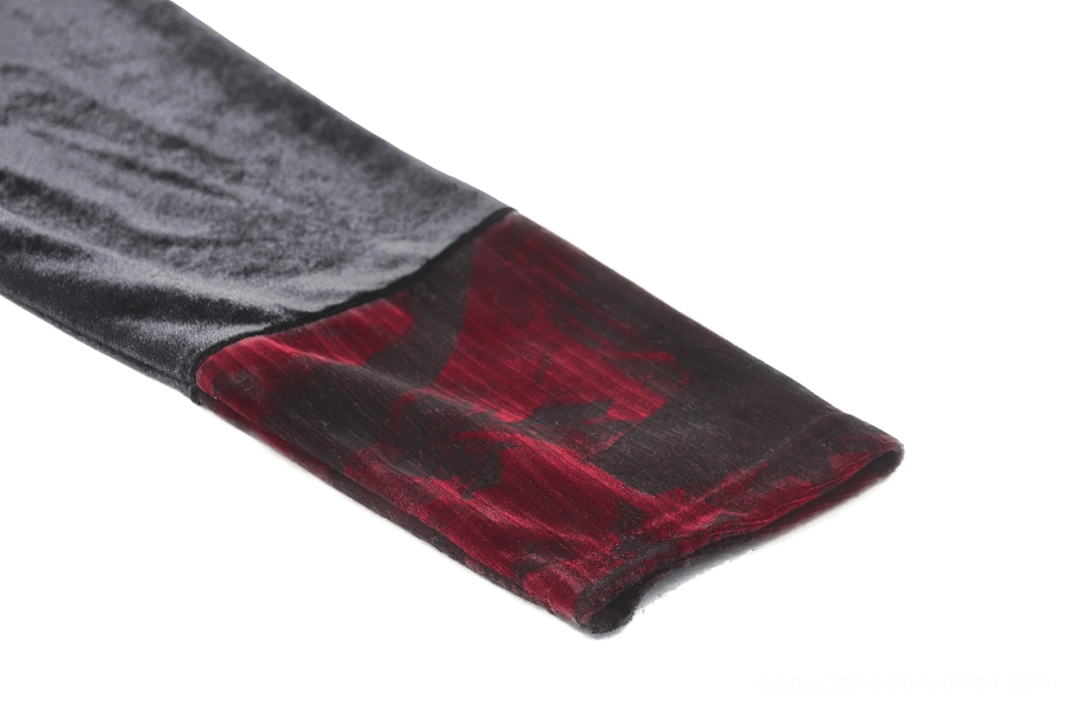 Gothic dress sleeve cuff close-up showing red velvet panel with black velvet base
