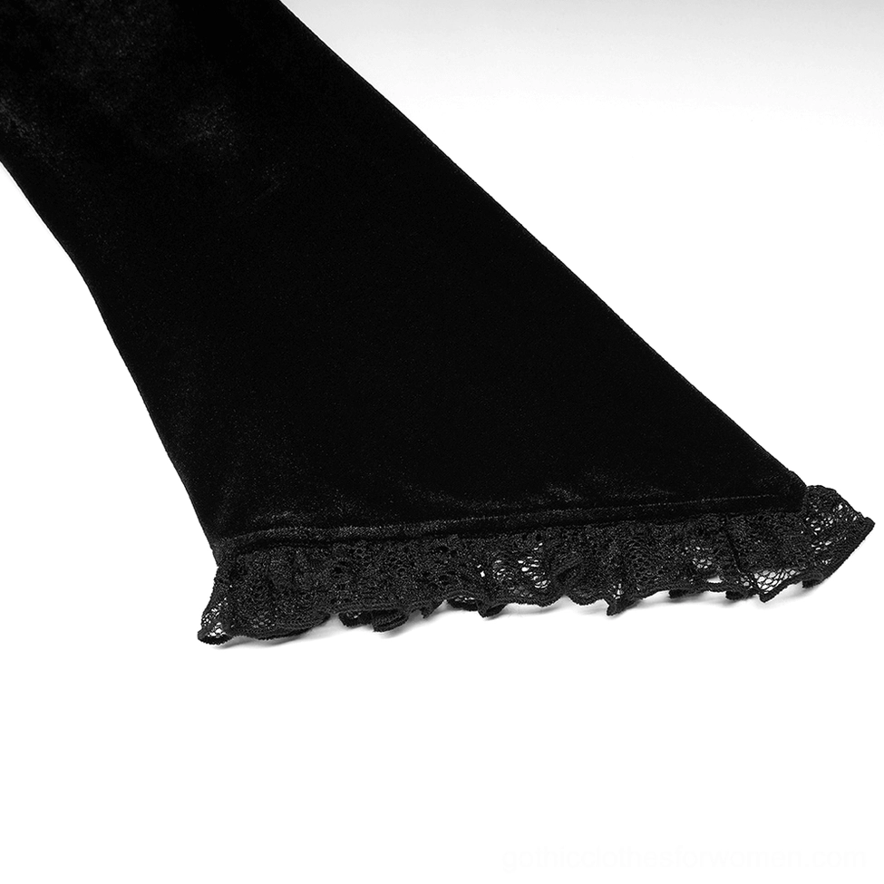 Close-up side view of black gothic velvet dress sleeve showing flared cuff with lace trim edge