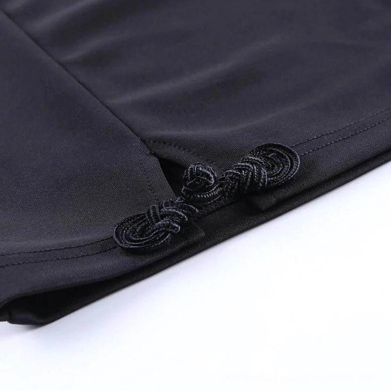 Detail shot of black gothic dress side slit and Chinese frog button closure