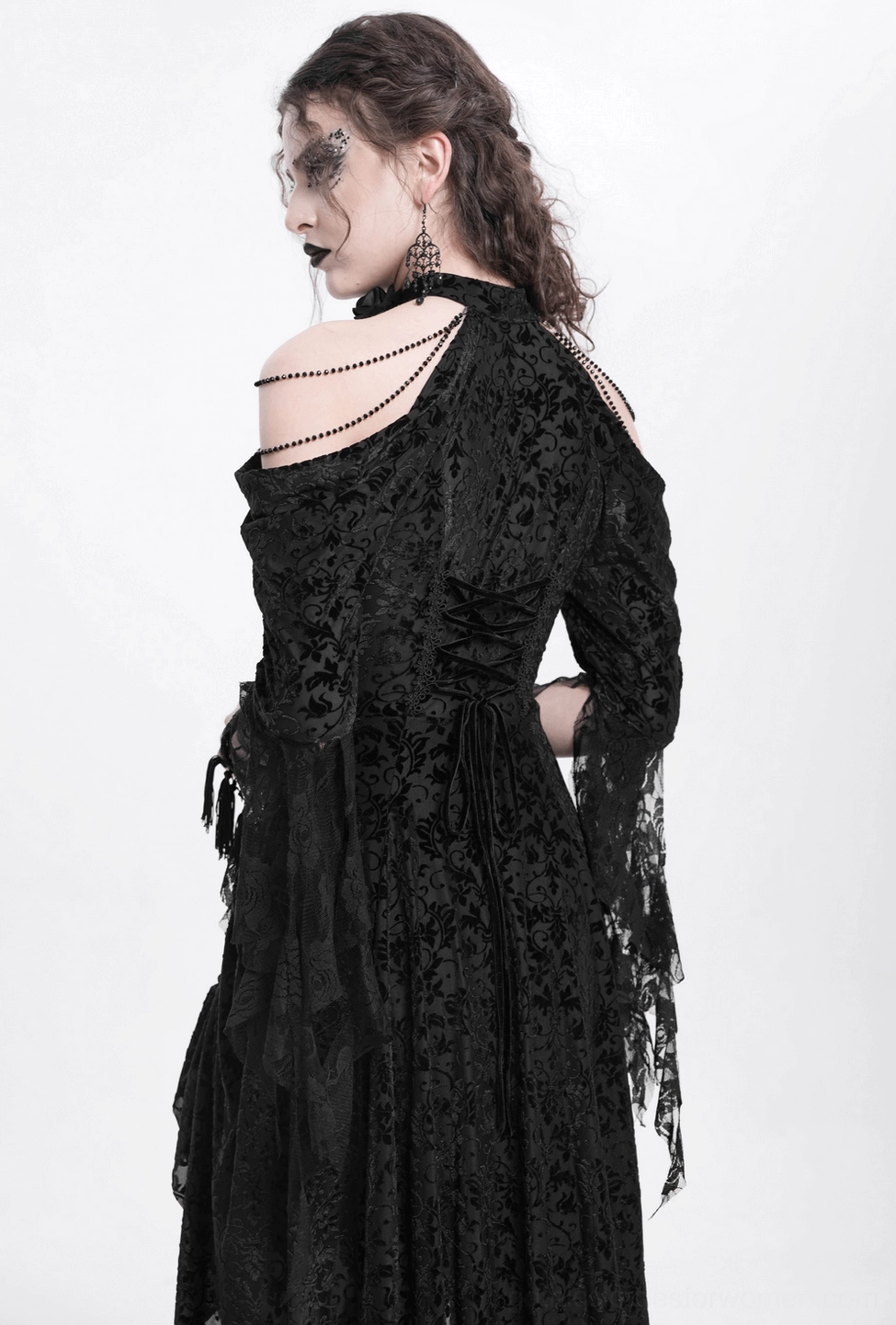Black gothic lace dress with theatrical ruffled neckline and cold-shoulder silhouette, style display