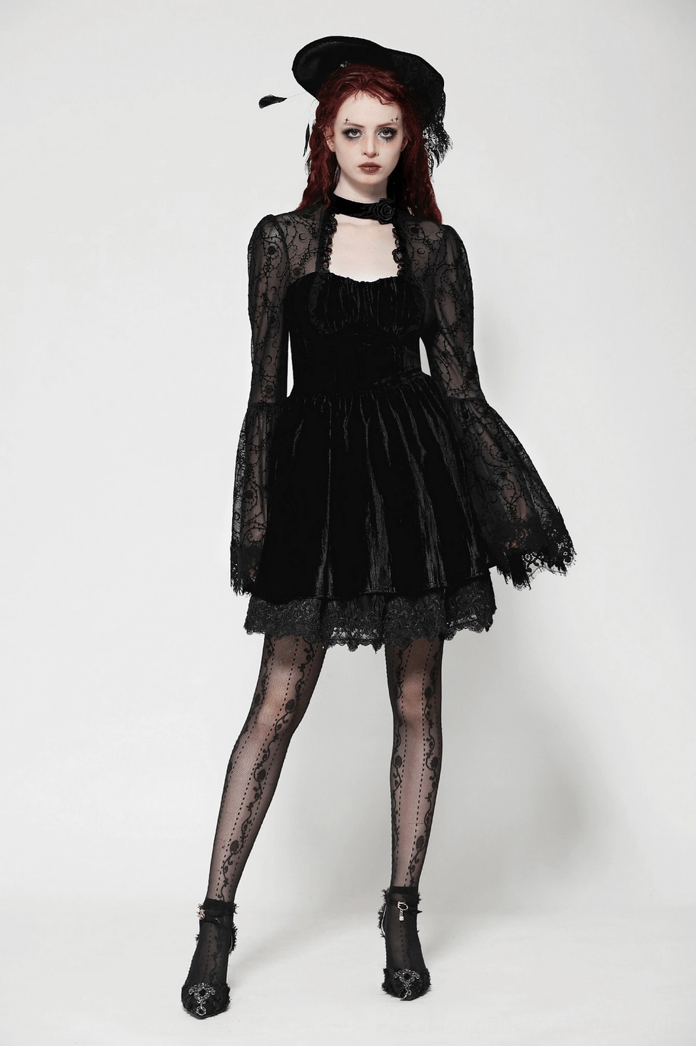 Gothic lace bell sleeve dress highlighting ornate scrollwork patterns and theatrical design elements