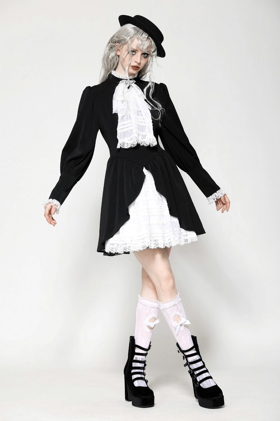Three-quarter angle view of black and white gothic lolita dress - lace details, tiered skirt, and overall silhouette