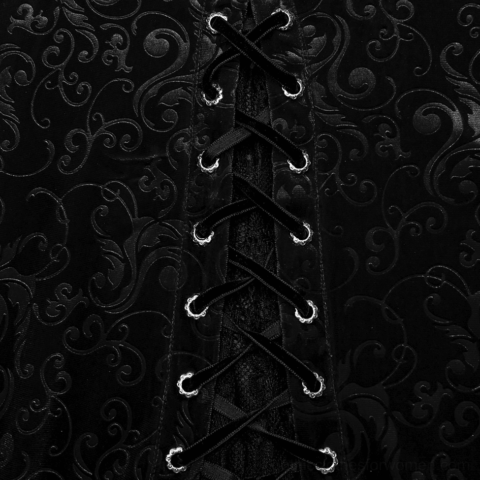 Close-up detail of velvet damask fabric and ribbon lace-up tie with metal eyelets on gothic dress, dark background