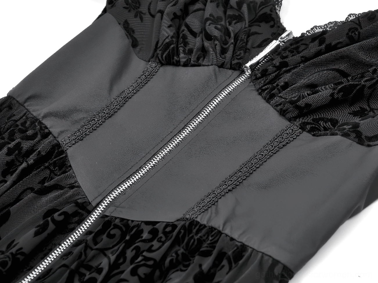 Close up detail of silver metal zipper and velvet lace panel on black gothic maxi dress